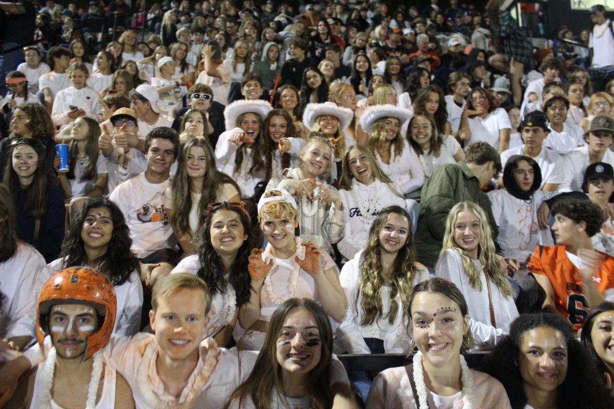 Many Summerville students at the Homecoming game this year posing for a picture. Showing some football game spirit with the White Out themed game!